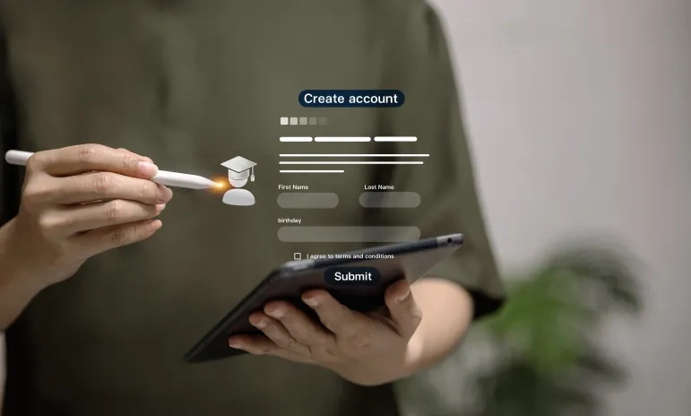 A digital "Create account" form interface is overlaid on a blurred image of hands holding a smartphone and stylus, showing fields for personal information and a graduation cap icon.