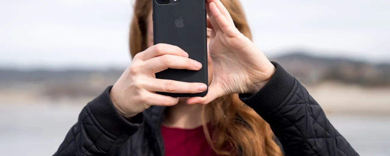 person holding mobile device