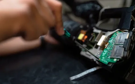 person holding circuit board