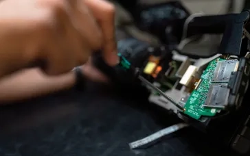 person holding circuit board